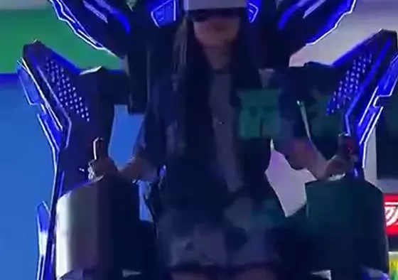 2. Players wear VR glasses and adjust seat straps.