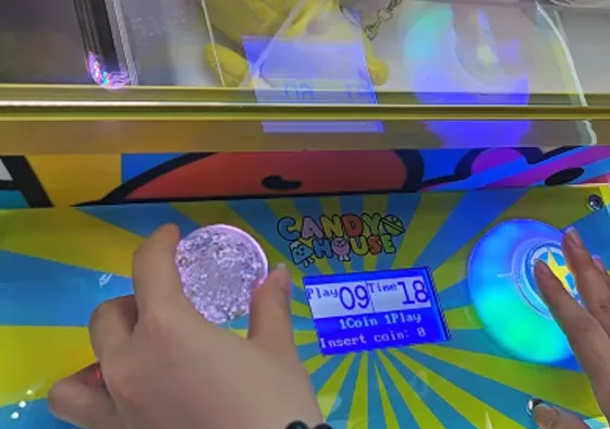 2. Use Joystick to Aim: Use the joystick to move the claw forward, backward, left, and right to find the optimal position for the claw to drop.