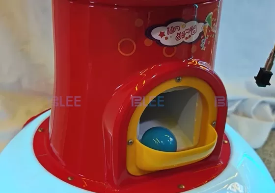 Step 3: Your capsule drops down automatically. Grab it from the dispenser slot and enjoy the toy or treat inside!