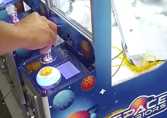 2. Control the claw above the gift position.