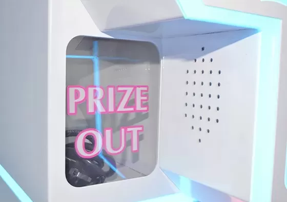 2. Control the claw above the gift position.