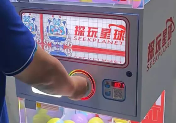 2. Rotate the Handle: Rotate the handle clockwise to eject the gashapon from the track.
