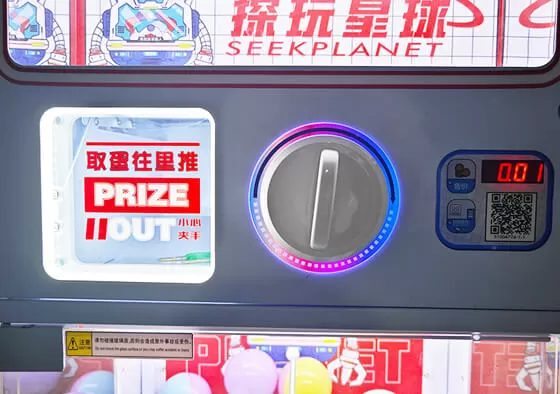 1. Coin/QR Code Payment: Insert coins or scan a QR code to unlock the gashapon machine.