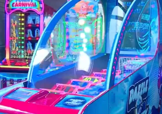 3. Power-Up Frenzy: Special power-ups appear on the playfield, granting temporary advantages like larger mallets or doubled ticket multipliers when activated by hitting the puck over them.