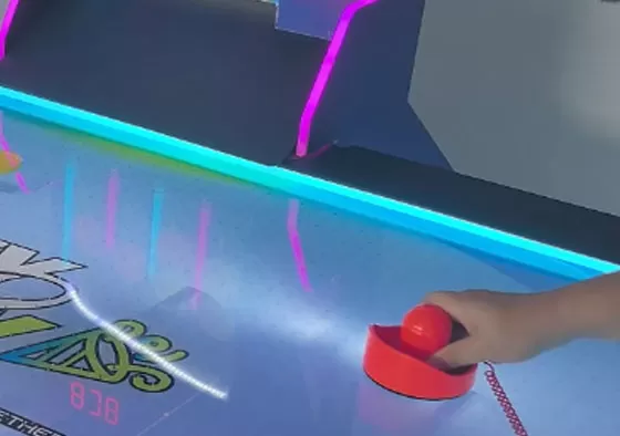 2. Control the Mallet, Attack & Defend: Rotate the handle to move your mallet and shoot the puck into the opponent’s goal to score. Defend by sliding your mallet to block shots. Quick rebounds an...