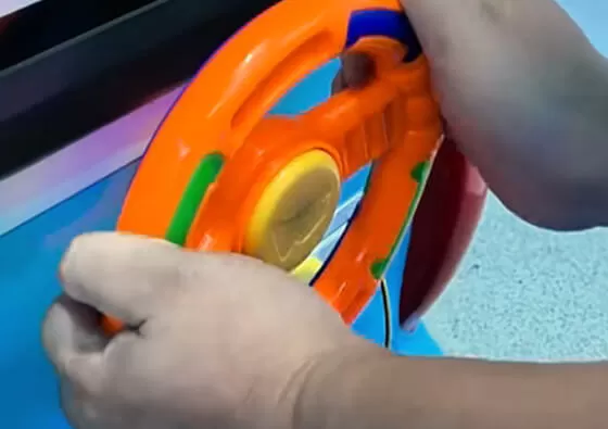 2. Music and Animation Entertainment: The integrated screen plays engaging content including construction-themed videos and upbeat children's songs throughout the ride.