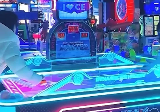 2. Control the Mallet, Attack & Defend: Rotate the handle to move your mallet and shoot the puck into the opponent’s goal to score. Defend by sliding your mallet to block shots. Quick rebounds an...