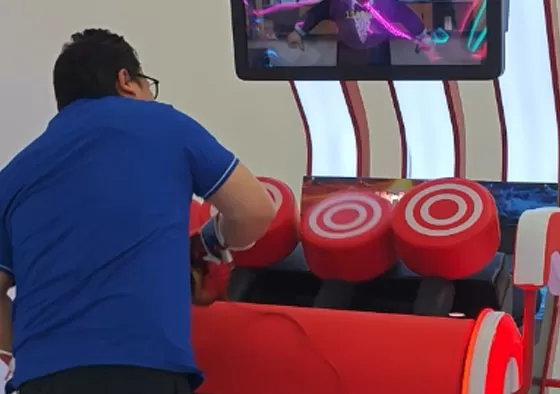 3. View your strength stats and score on the digital screen. Compete for high scores and win prizes based on your performance.