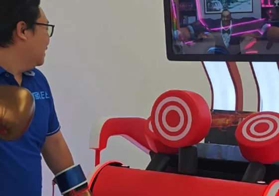 2. Put on your boxing gloves and hit the punching bag with all your might.