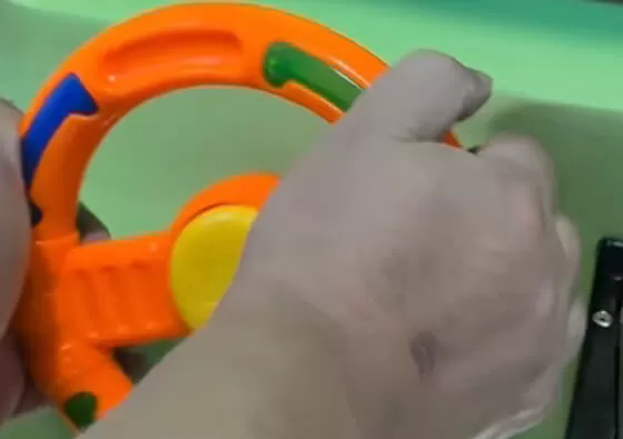 2. Mount Securely: Children sit comfortably in the green rescue truck, holding onto the secure grips for stability during the ride.