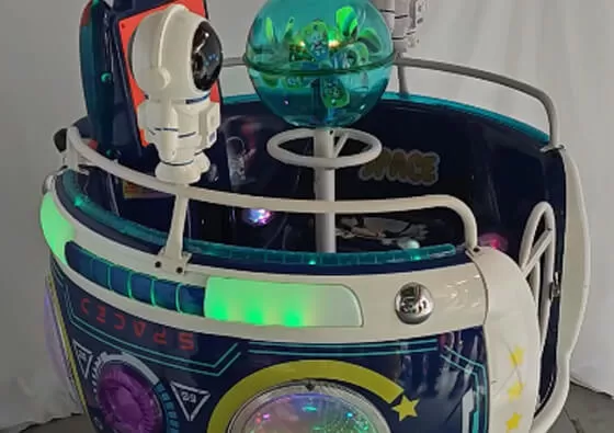 2. Board the Space Cup: Children climb into the comfortable spinning cup seat, surrounded by the friendly astronaut figures and planet details.