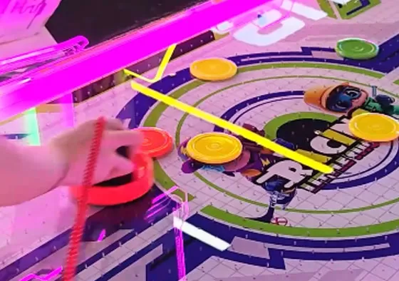 2. Control the Mallet, Attack & Defend: Rotate the handle to move your mallet and shoot the puck into the opponent’s goal to score. Defend by sliding your mallet to block shots. Quick rebounds an...