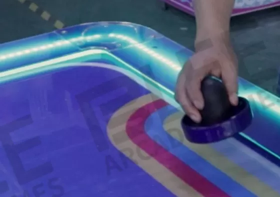 2. Control the Mallet, Attack & Defend: Rotate the handle to move your mallet and shoot the puck into the opponent's goal to score. Defend by sliding your mallet to block shots. Quick rebounds...