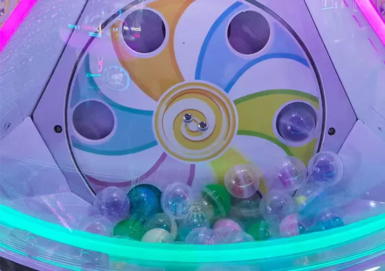 3. Collect the Capsule: Retrieve the capsule from the outlet and open it to discover the surprise inside.